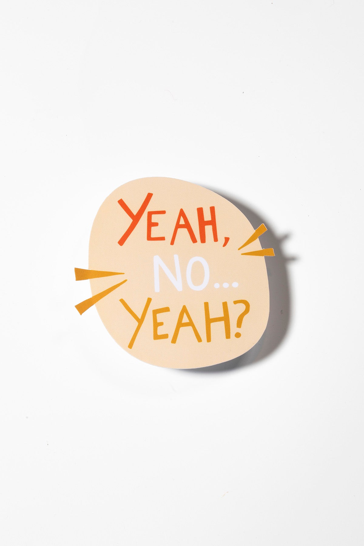 Yellow sticker that reads "yeah, no...yeah?" in orange, white and yellow photographed on a white background.