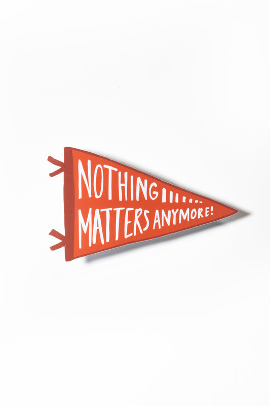 Red pennant sticker that reads "Nothing matters anymore" shot on a white background.